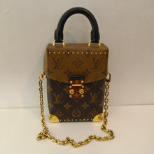 Load image into Gallery viewer, This Louis Vuitton Vintage Reverse Monogram Camera Box is in the original Louis Vuitton Monogram pattern with the lid being lighter than the body of the box. It has gold trim which includes a shoulder chain, corner protectors, the clasp and small metallic dots on front of flap and at bottom of box. It has  black carrying handle and interior.

