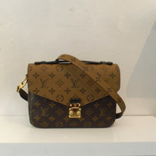 Load image into Gallery viewer, This Louis Vuitton Vintage Reverse Monogram Metis Pochette is in the original monogram pattern which includes the strap. It has gold hardware and a top handle along with the shoulder strap. 
