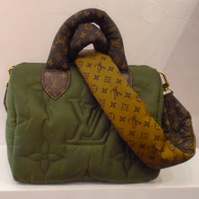 Load image into Gallery viewer, This Louis Vuitton Vintage 25 Pillow Econyl has an olive green puffy body with puffy brown monogram carrying handles. It also has a reversible and detachable nylon monogram shoulder strap. This shoulder strap is dark brown monogram on one side and camel monogram on the other.  The interior of this bag is dark brown monogram.
