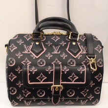 Load image into Gallery viewer, This Louis Vuitton Vintage Speedy 30 is black with a pink monogram pattern. The trim is black with some pink outlining. It comes with a black detachable adjustable shoulder strap. This bag has gold hardware and a pink interior.  It has a buckled pocket on the front of the bag.
