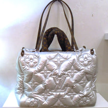 Load image into Gallery viewer, This Louis Vuitton Vintage Silver-Pillow Monogram On The Go GM is a soft silver pillowy bag in the stitched monogram. It has two puffy carrying handles in the dark brown monogram and double thin shoulder straps in the dark brown monogram. The interior of this bag is also in the dark monogram.
