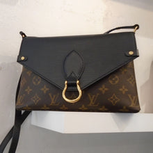 Load image into Gallery viewer, This Louis Vuitton Vintage Traditional Monogram/Epi Saint Michel combines the monogram with a bold black flap that has an unexpected texture.  This combination along with the  gold horse shoe on the lip of the flap definately gives this bag character. It comes with a black adjustable shoulder strap which can be  doubled for a carrying handle. The interior of this bag is a soft black.
