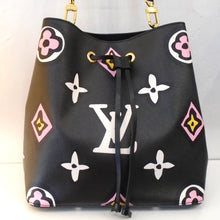 Load image into Gallery viewer, This Wild At Heart Neo Noe is black with a white Louis Vuitton Logo on the front center of the bag. It has Large monogram pattern in white, pink and yellow. This bag comes with an adjustable detachable shoulder strap. The interior of the bag is black with a leopard zippered pocket in the center.
