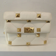 Load image into Gallery viewer, This Valentino Ivory Roman Shoulder Bag has gold hardware which includes the geometric squares pressed into the bag. It has a gold shoulder chain and shoulder guard made of same material as the bag. The interior of this bag is a grayish beige.
