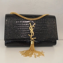 Load image into Gallery viewer, This YSL Crocodile Embossed Leather &quot;Kate&quot; is black and embossed to look like Crocodile skin. It has gold hardware which includes the YSL Logo latch, tassel and shoulder chain. This bag has a front flap and black interior.
