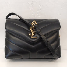 Load image into Gallery viewer, This YSL Chevron Mini Lou Lou With Gold Hardware has the YSL Logo in gold on the front flap. It has a shoulder strap and the interior of the bag is also black.
