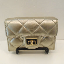 Load image into Gallery viewer, This is a small hand held gold tone wallet with diamond design stitching. It has a gold clasp on the front and opens up to hold essentials.
