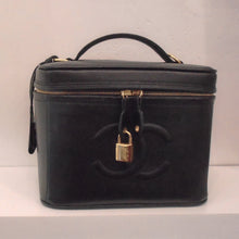 Load image into Gallery viewer, This Chanel Vintage Black Caviar Vanity Bag has the square look of a vanity bag with a zipper running around the top of the bag. It has gold hardware, a lock and key, and a detachable shoulder strap included.
