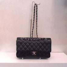 Load image into Gallery viewer, This Chanel Vintage Black Medium Double Flap has silver hardware and the silver shoulder chain has a black leather strip interwoven between the chain links.
