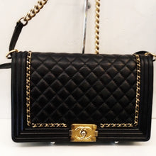 Load image into Gallery viewer, This Chanel Vintage Limited Edition Calfskin Le Boi is in the traditional diamond stitching pattern. It has gold hardware which includes a chain with a black strip running through it that lines the inside square of the flap and goes around to the back flap, a gold shoulder chain and  gold clasp on flap with Chanel CC on it.
