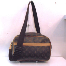 Load image into Gallery viewer, This Louis Vuitton Vintage Monogram Reporter PM has a camel leather strip on the front pocket of the bag, double zippers on the opening and a thick brown fabric adjustable shoulder strap. The inside of the bag is cream colored with an inside zippered pocket.
