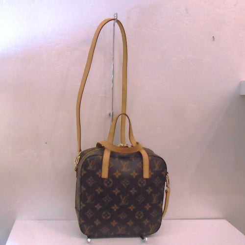 This Louis Vuitton Vintage Monogram Spontini has camel trim and  double handles with a detachable strap. This bag was custom made.  The inside of this bag is white.